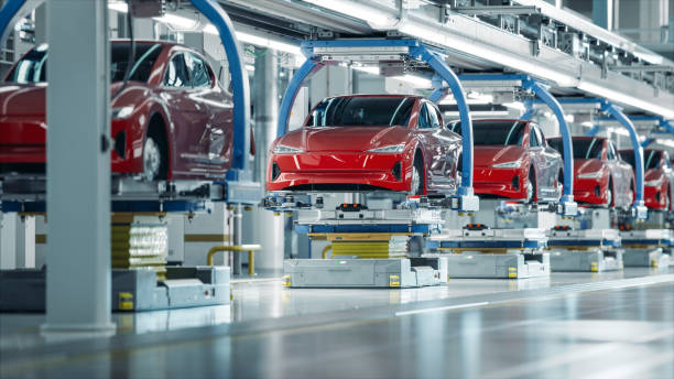 Cars being being in manufacturing line