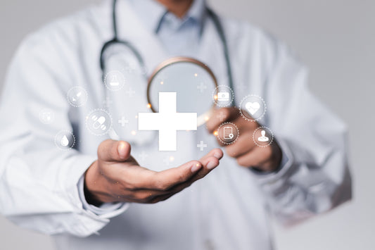 Doctor holding health sign in hand.